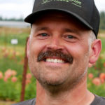 Triple Wren Farms owner Steve Pabody in flower field